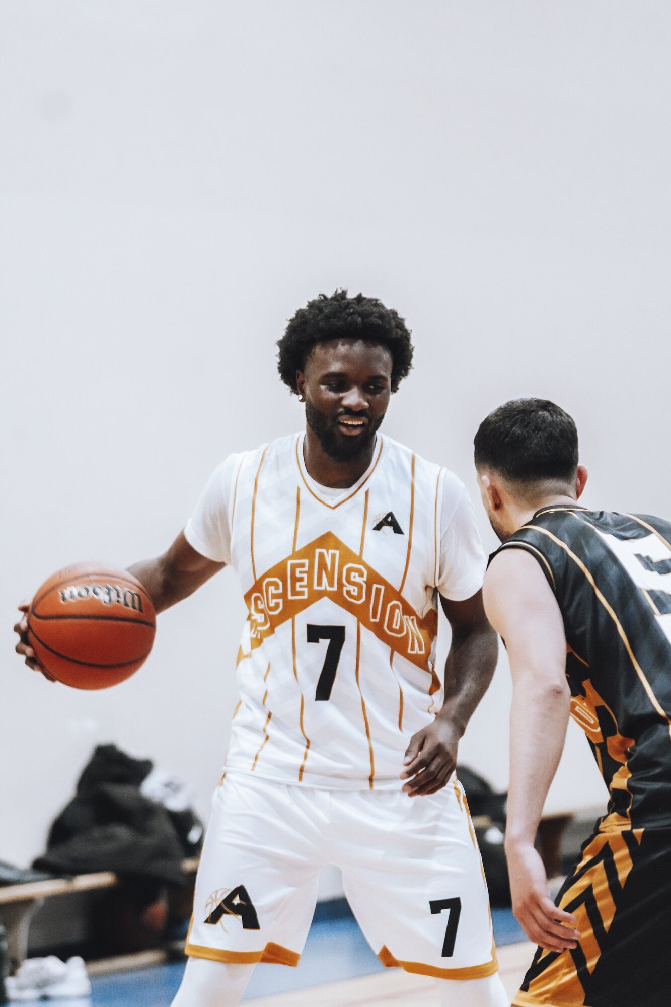 Player driving to the basket in a one-on-one matchup