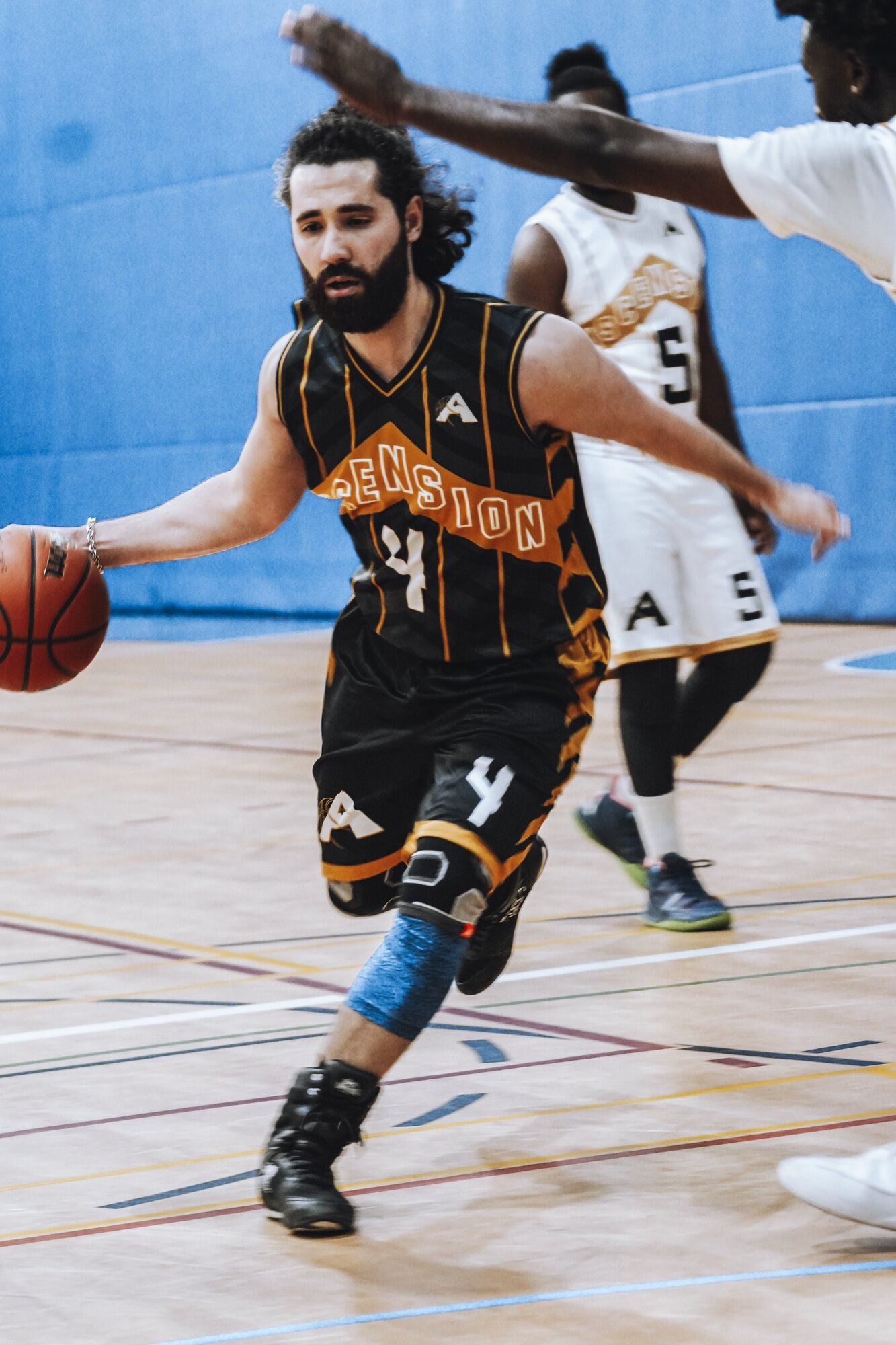 Player finishing a crossover move on the court